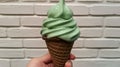 a hand holding an Mint Choco ice cream cone - ai. Royalty Free Stock Photo