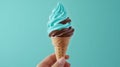 a hand holding an Mint Choco ice cream cone - ai. Royalty Free Stock Photo