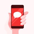 Hand holding mobile phine with a speech bubble sign Royalty Free Stock Photo