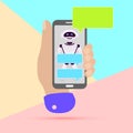 hand holding mobile phone with chat robot bot message notifications on pastel colored blue and pink background. Arm with Royalty Free Stock Photo