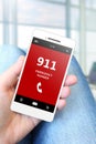 Hand holding mobile phone with emergency number 911 Royalty Free Stock Photo