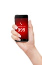 Hand holding mobile phone with emergency number 999 Royalty Free Stock Photo