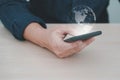 Hand holding mobile phone with global network connection, Hand man with earth virtual on blurred background. Royalty Free Stock Photo