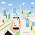 Hand holding mobile phone with navigation application