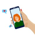 Hand holding mobile phone, video call, conversation. Woman face on the smartphone screen. Communication concept on white Royalty Free Stock Photo