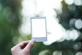 A hand holding mockup of polaroid photo frame Royalty Free Stock Photo