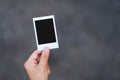 A hand holding mockup of polaroid photo frame Royalty Free Stock Photo