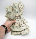 Hand holding money, american twenty dollars bills on a white background Royalty Free Stock Photo