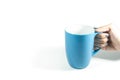Hand holding mug, blue mug/Coffee cup Royalty Free Stock Photo