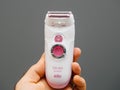 Hand holding new Braun Silk Epil Xpressive women shaver epilator Royalty Free Stock Photo