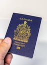 Hand holding a Canadian passport Royalty Free Stock Photo