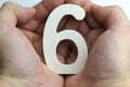 Hand holding number six. Royalty Free Stock Photo