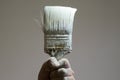 Hand holding an old paint brush Royalty Free Stock Photo