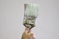 Hand holding an old paint brush Royalty Free Stock Photo