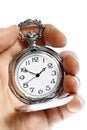 Hand holding old pocket watch