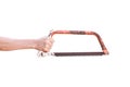 Hand holding old rusty bow saw isolated on white background Royalty Free Stock Photo