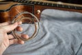 Hand holding old steel guitar strings