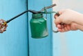 Hand Holding Old Vintage Green Oil Can Royalty Free Stock Photo