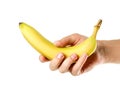 Hand holding one banana. Close up. Isolated on white background Royalty Free Stock Photo