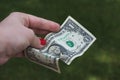 Hand holding one dollar bill Royalty Free Stock Photo