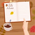 Hand holding an open Autumn Daily Diary notepad, list schedule, goals, to do, acorn, autumn leaves, coffe cup. Personal Royalty Free Stock Photo