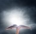 Hand holding on opened magic book Royalty Free Stock Photo