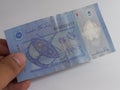 Hand holding opposite side of one Malaysian ringgit banknote Royalty Free Stock Photo