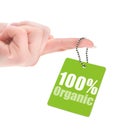 Hand holding 100% organic label