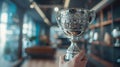 The hand holding ornate trophy..AI generated image Royalty Free Stock Photo