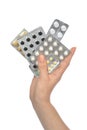 Hand holding packs of medicine aspirin painkiller tablet pills