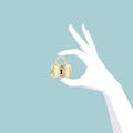 Hand holding padlock, hand is white.lock is golden