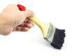 Hand holding paint brush on white background Royalty Free Stock Photo