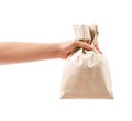 Hand holding paper bag isolated on white Royalty Free Stock Photo