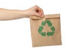 Hand holding paper bag with recycle sign, isolated Royalty Free Stock Photo