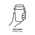 Hand holding paper cup with drink line icon. Take away concept.