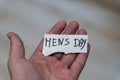 A hand holding a paper with handwritten words Mens Day. The background is blurred, emphasizing the importance of recogni Royalty Free Stock Photo