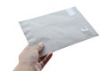 Hand holding paper mail on white Royalty Free Stock Photo