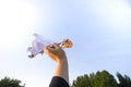 Hand holding paper origami bird made by child Royalty Free Stock Photo