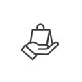 Hand holding paper shopping or gift bag icon. Purchases isolated modern outline on white background