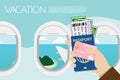 Hand holding passport, boarding pass , pocket money and credit card with island view outside the window on the plane at background