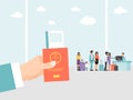 Hand holding passport and ticket on airport background. People in airport with luggage stand in queue on flight. Man Royalty Free Stock Photo