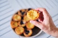 Hand holding Pasteis de Belem, Portuguese pastel de Nata Custard Tarts.