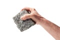 Hand Holding a Pave Stone Down Royalty Free Stock Photo