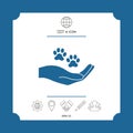 Hand holding paw symbol. Animal protection