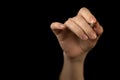 Hand is holding pen isolated on black background, pointing idea, make a note concept, copy space photo Royalty Free Stock Photo