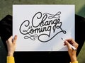 Hand Holding Pen Paper Writing Change is Coming Board Concept Royalty Free Stock Photo