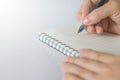 Hand holding pen writing notebook Royalty Free Stock Photo