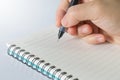 Hand holding pen writing notebook Royalty Free Stock Photo