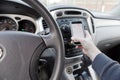 Distracted driver with phone in hand, vehicle interior Royalty Free Stock Photo