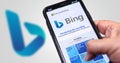 A hand holding a phone with the Microsoft Bing website on the screen Royalty Free Stock Photo